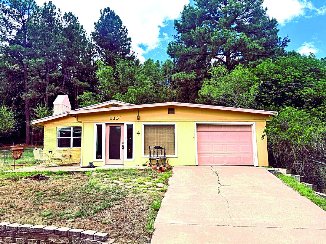 Property in Ruidoso — photo as printed in The Real Estate Roundup