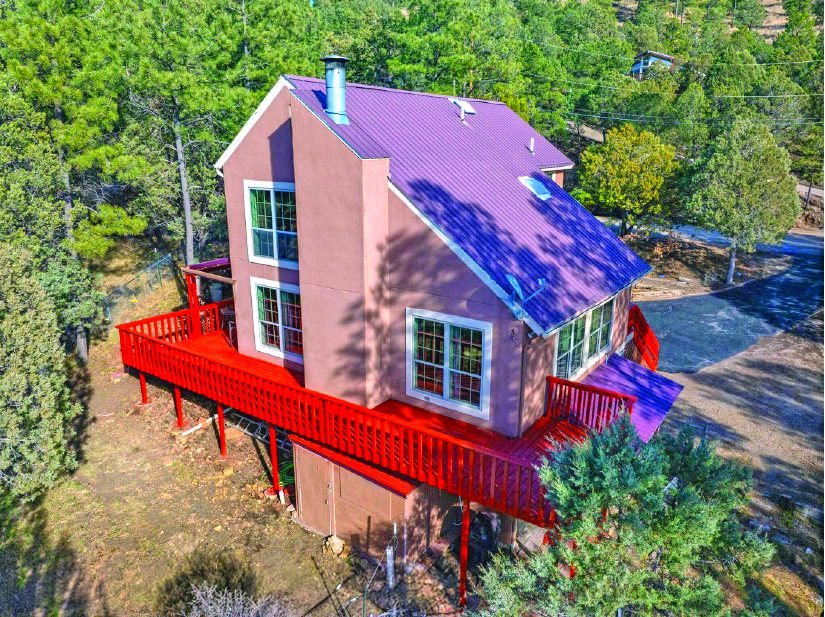 208 High Loop Drive — photo as printed in The Real Estate Roundup