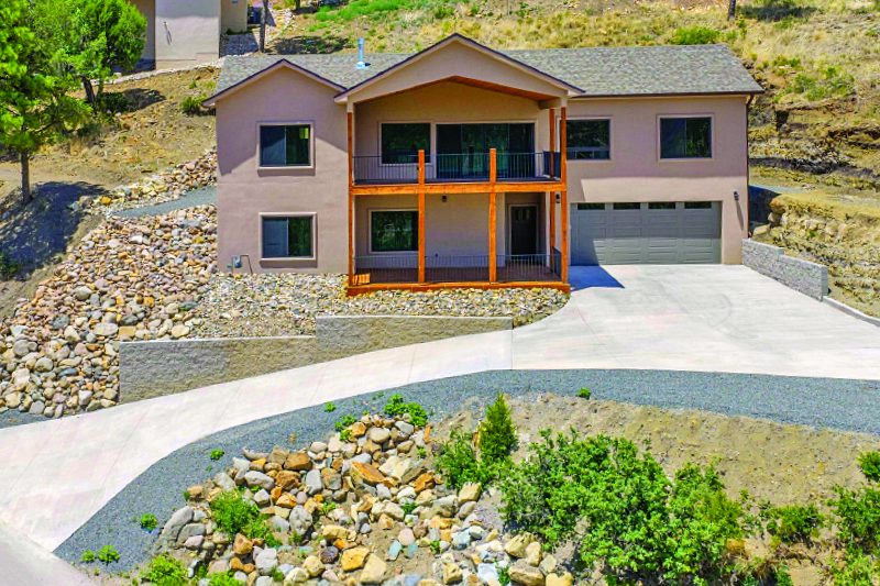 519 Mountain High Circle — photo as printed in The Real Estate Roundup