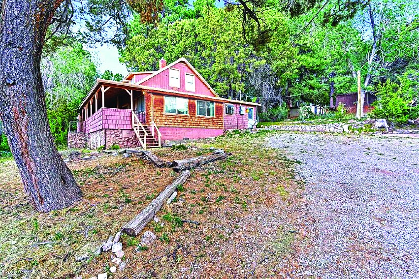 69 Haynes Canyon Rd, High Rolls/Mtn Park — photo as printed in The Real Estate Roundup