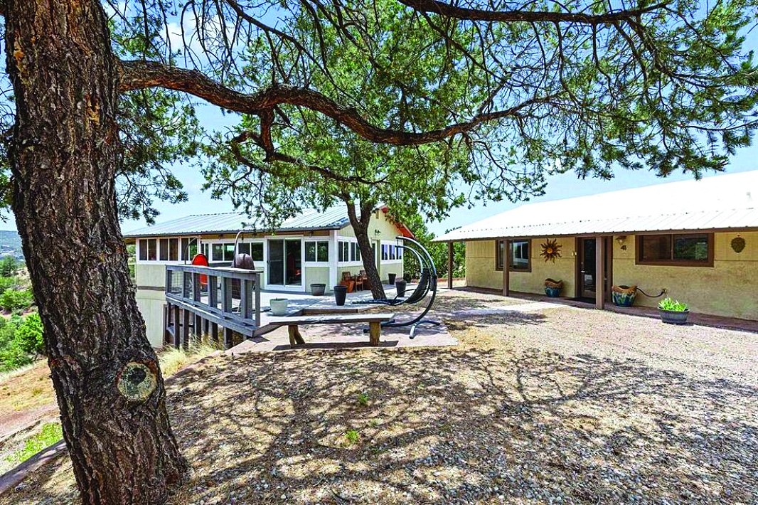 41 Calico Peak, High Rolls Mtn Park — photo as printed in The Real Estate Roundup