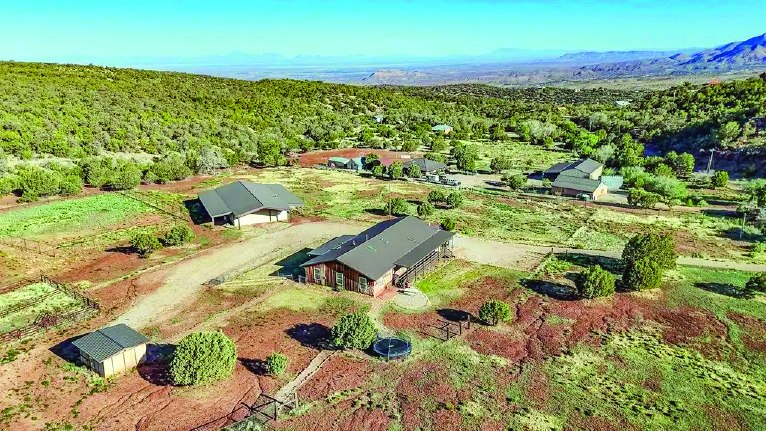 128 Westside Rd — photo as printed in The Real Estate Roundup
