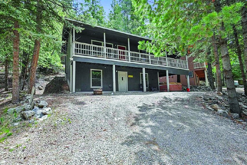 300 Woodlands Way — photo as printed in The Real Estate Roundup